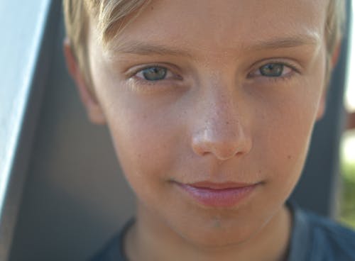 Boy's Face in Close Up Photography