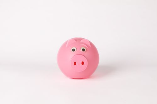Free Cute pink piggy bank on a clean white background, symbolizing savings and finance concepts. Stock Photo