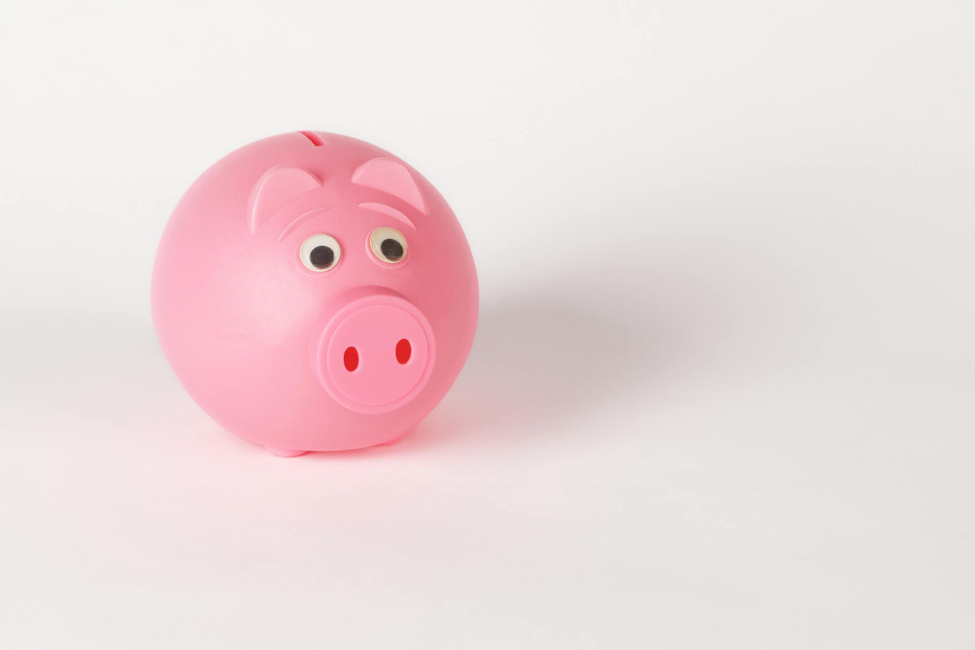 Close-Up Photo of Cute Pink Piggy Bank