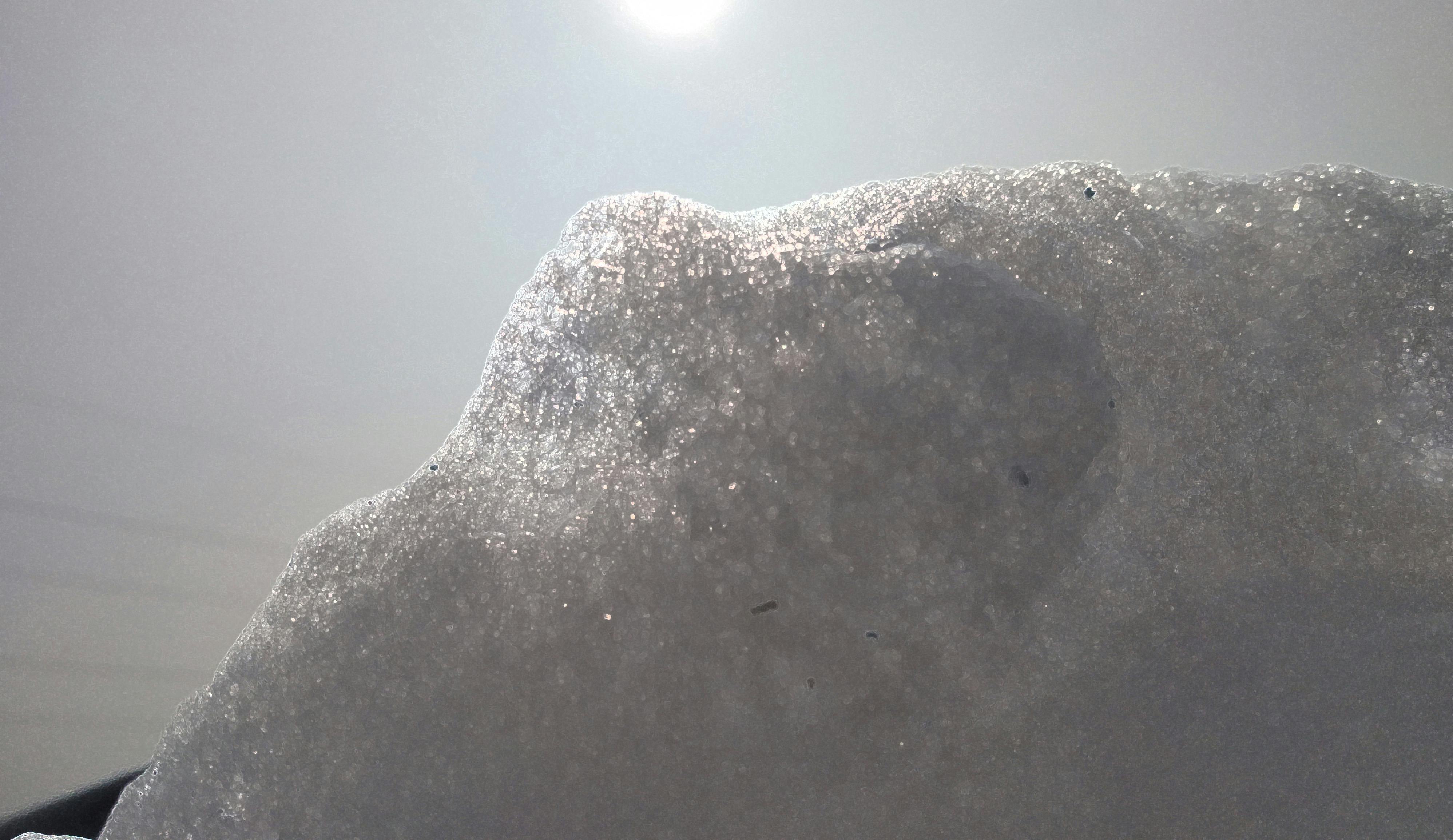 Person writing in a planner with neatly arranged stationery