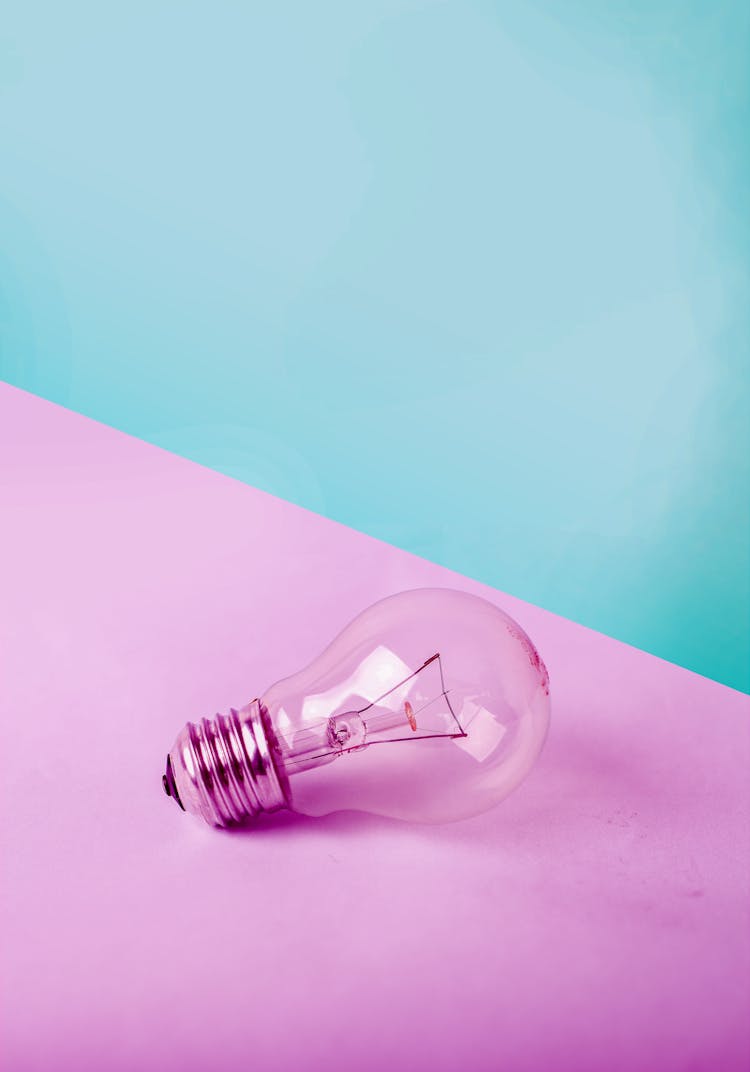 Light Bulb On White Surface