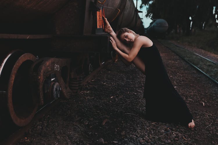 Person Holding Brown Wooden Stick