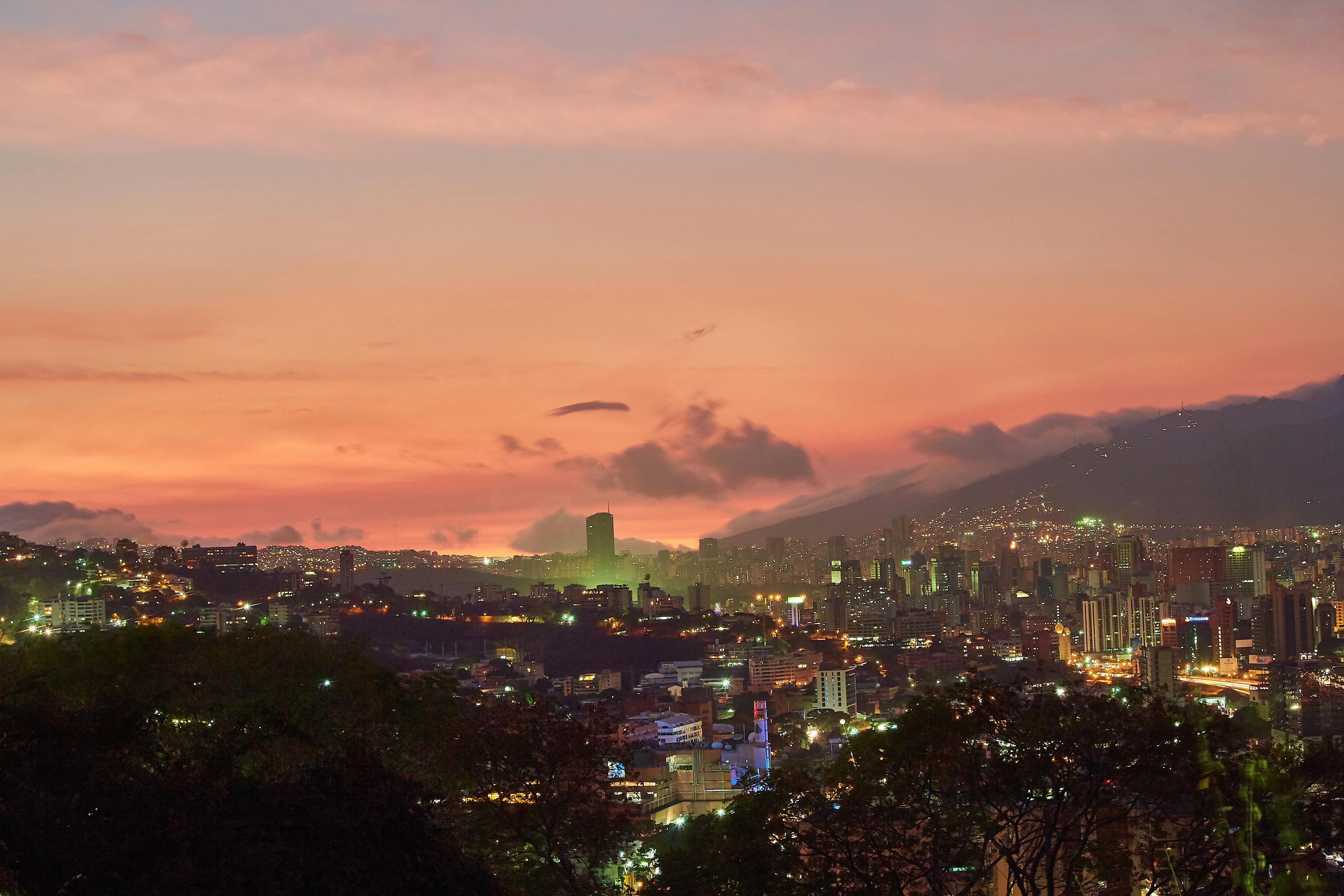 city-with-high-rise-buildings-during-night-time-free-stock-photo