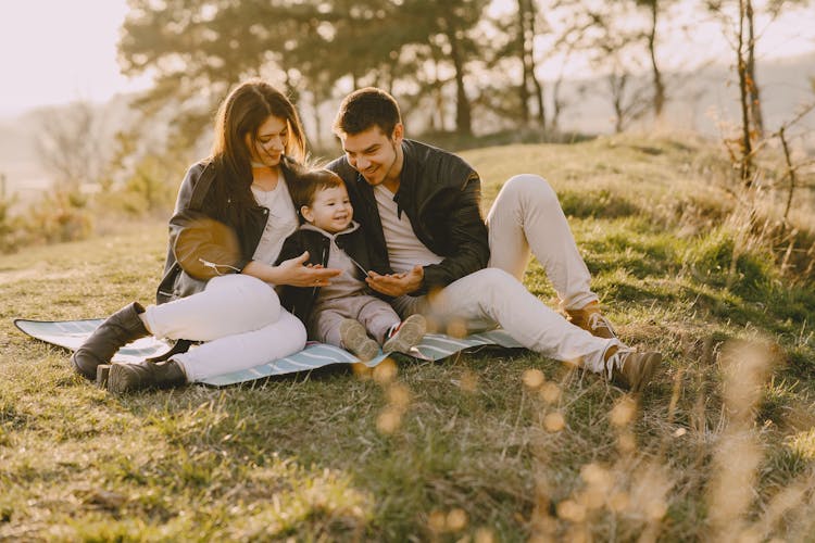 Happy Family In Countryside On Sunny Day