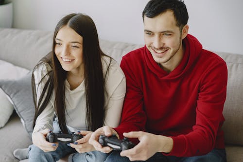 Free Photo of Man and Woman Playing Stock Photo