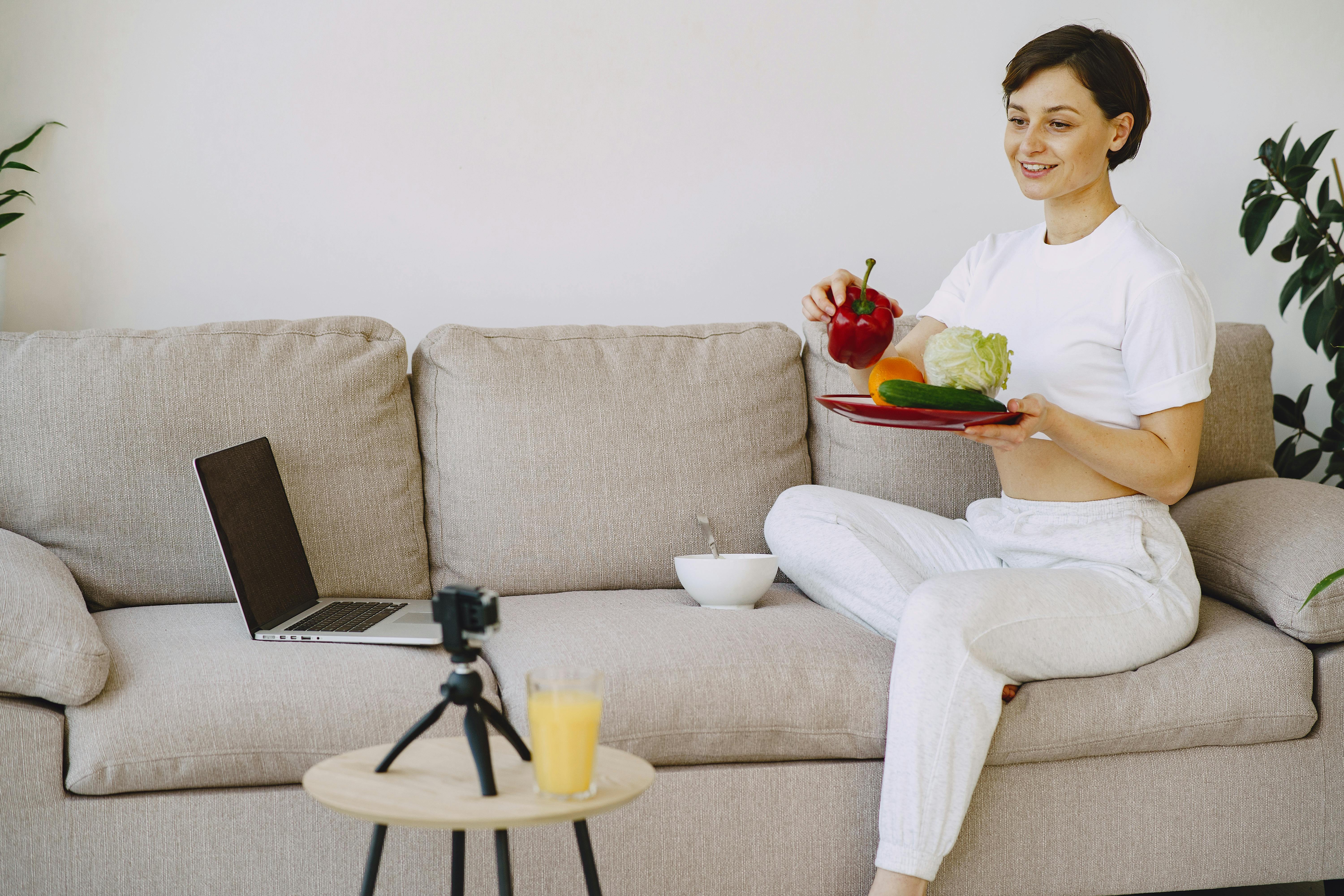 smiling woman with plate with fresh food