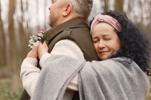 Photo of Woman Hugging Her Man