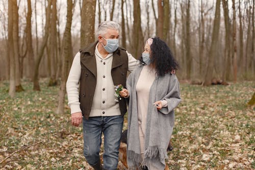 Man and Woman Standing on Forest