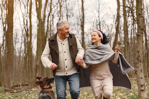 Photo of Man and Woman Looking at Each Other While Smiling