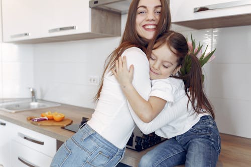 Free Photo of Mom and Daughter Hugging Each Other Stock Photo