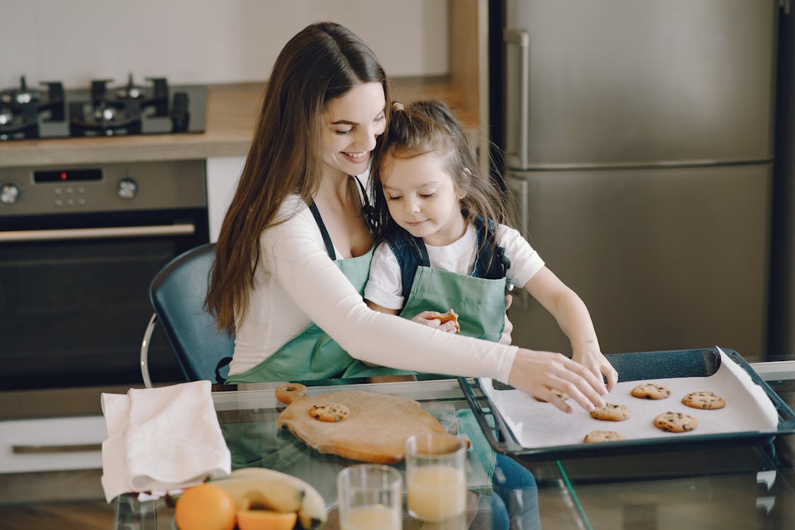 Photo of Woman and Child Baking Cookies