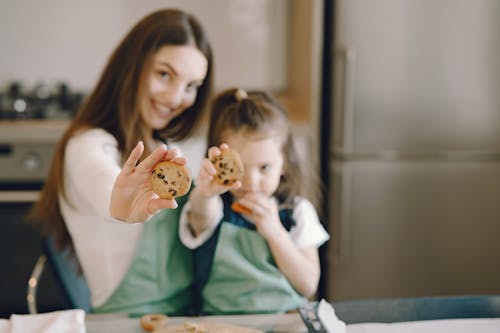 Shallow Focus Photo of Person Holding Cookies