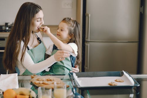 Free Photo of Woman Eating Cookie Stock Photo