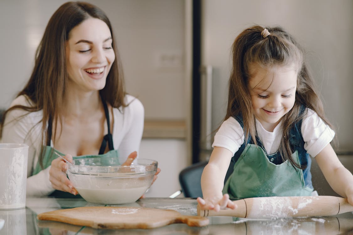 Free Photo of Girl Using Rolling Pin Stock Photo