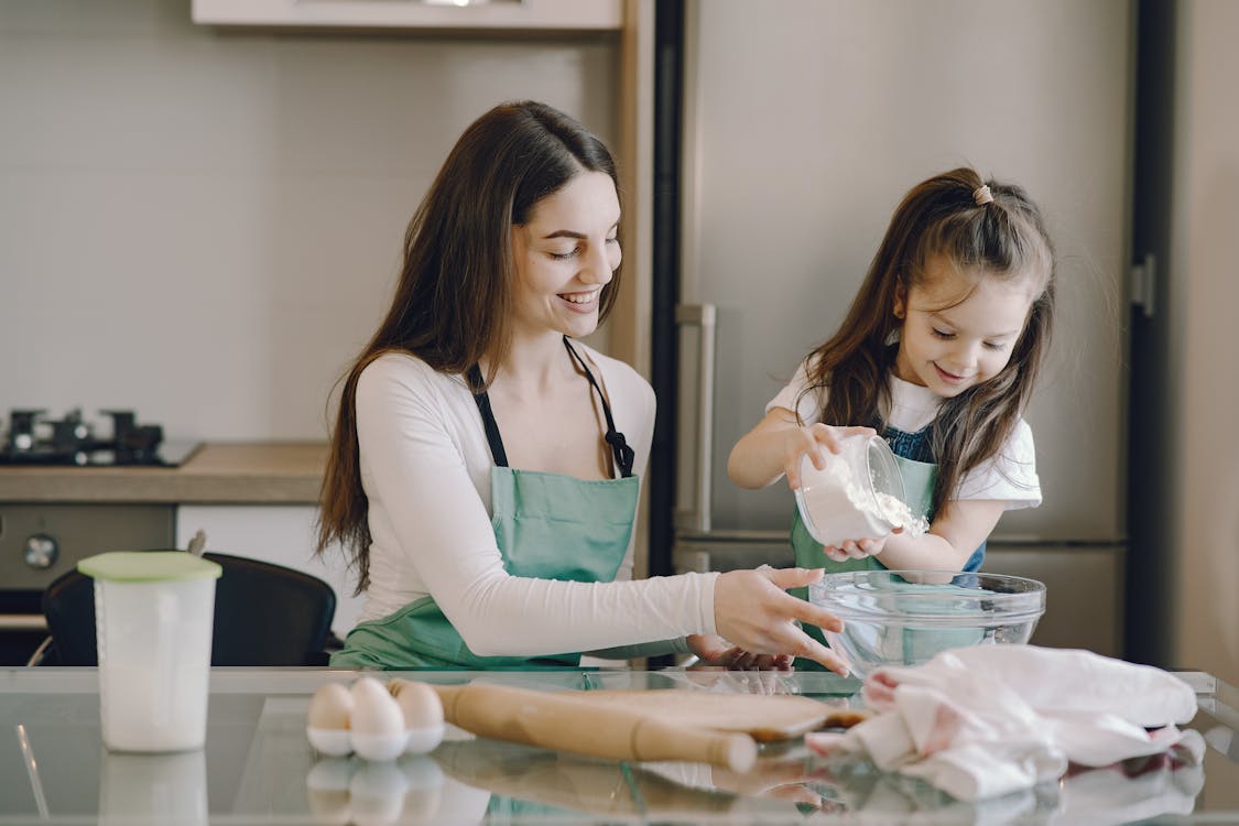 Free Photo of Girl Pouring Flour on Bowl Stock Photo