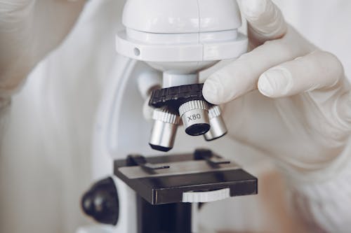 Free Person Holding Microscope Stock Photo