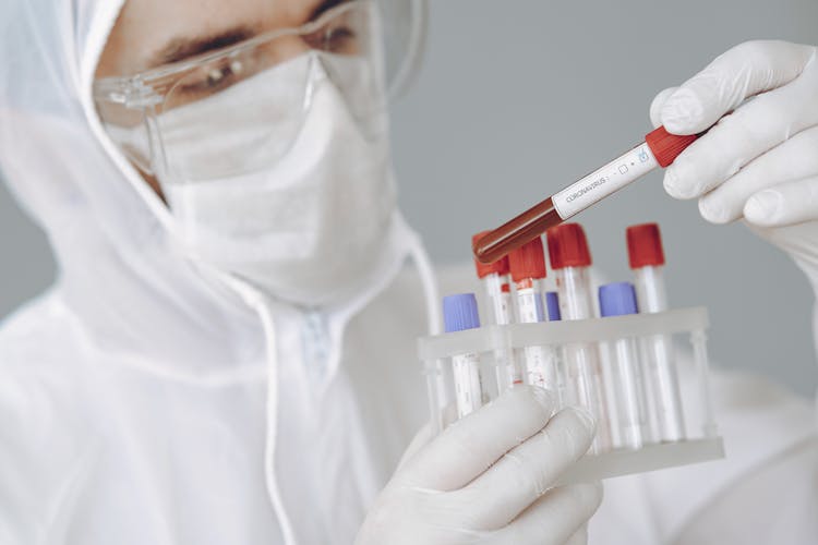 Crop Scientist Holding Test Tube With Positive Coronavirus Result