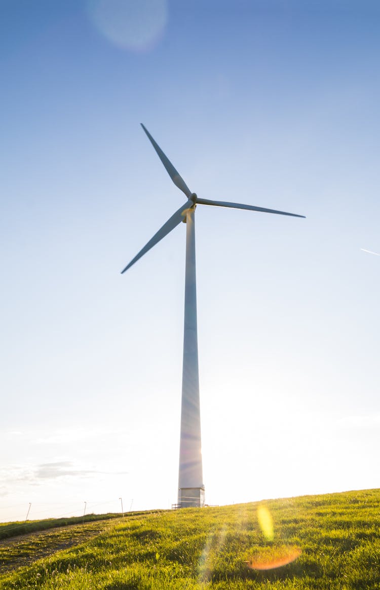 White Windmill On Grass Field