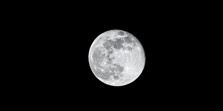 Full Moon On Black Background At Night