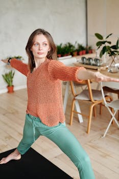 Adult woman in yoga pose on mat indoors, creating a peaceful home exercise atmosphere.
