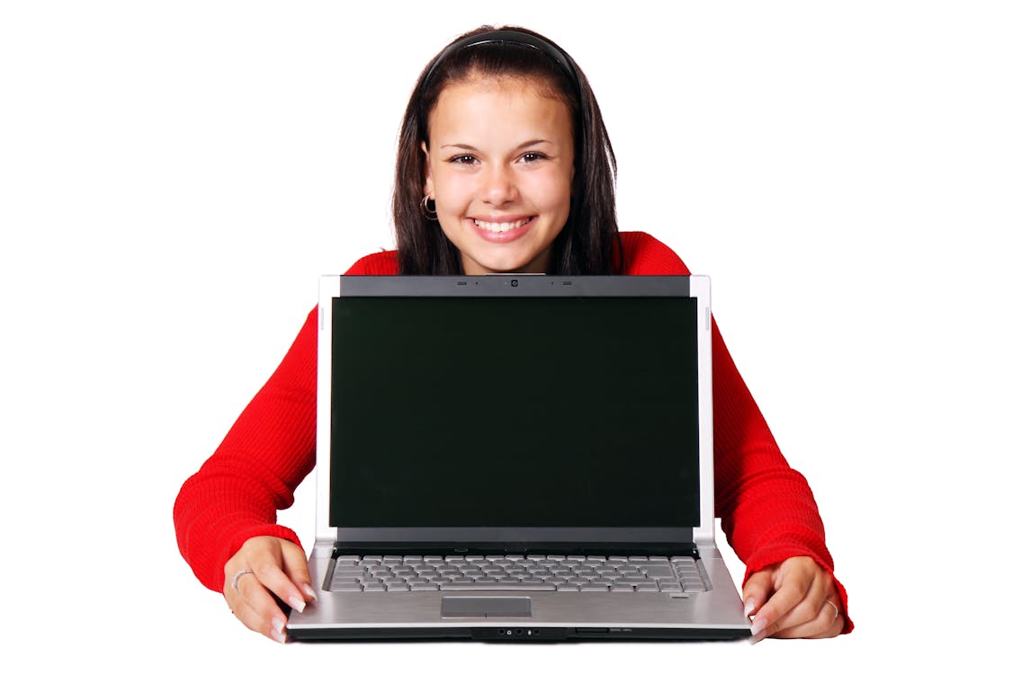 Free Smiling Woman Holding Gray Laptop Stock Photo