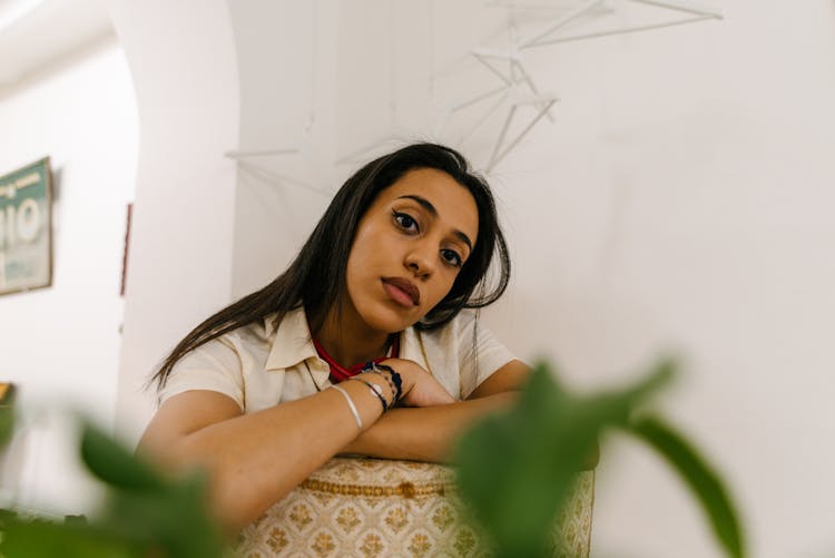 Portrait Of Beautiful Woman Leaning On Chair