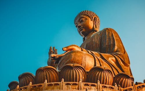 Gold Buddha Statue Under Blue Sky