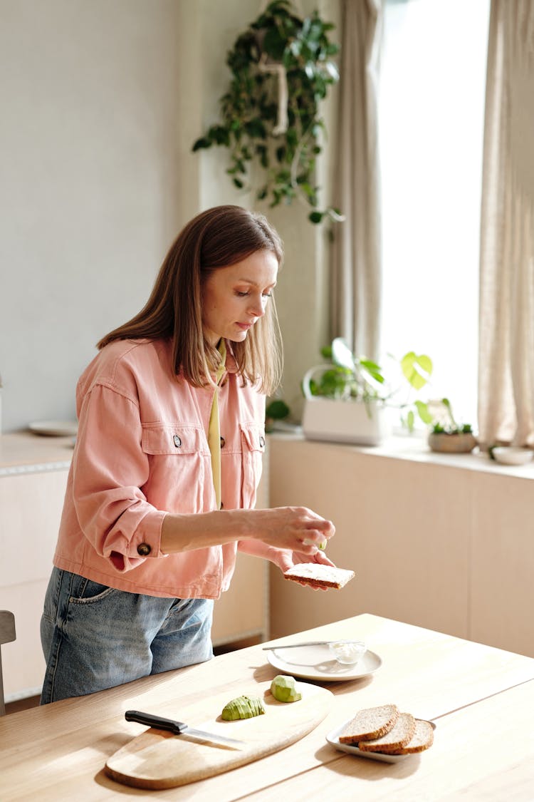 A Woman Preparing Snack In The Kitchen