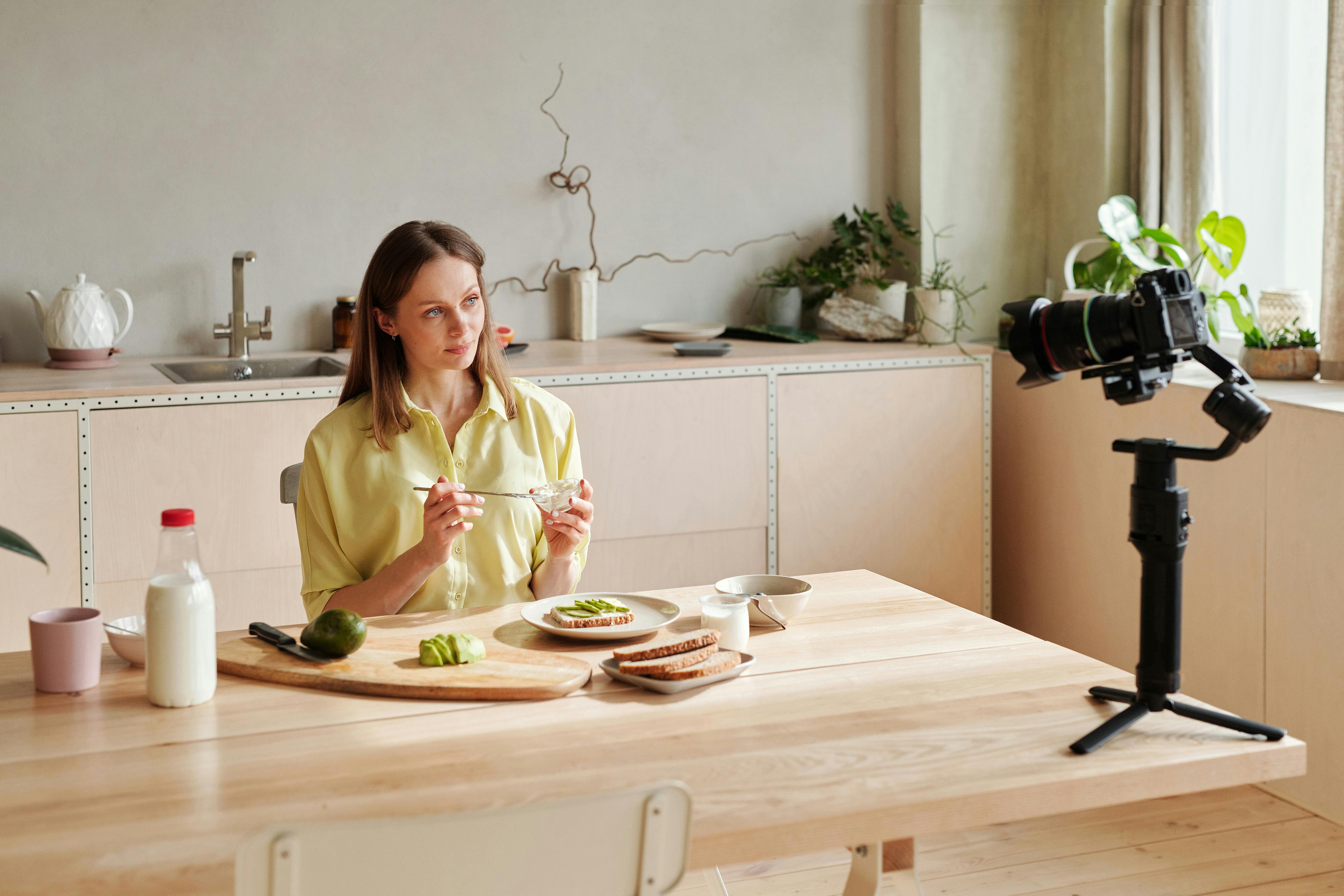 woman recording herself preparing breakfast