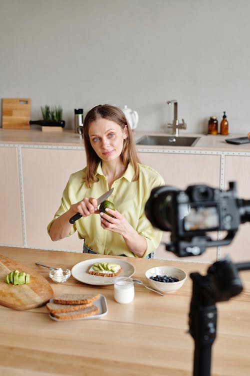 Woman Filming Herself While Peeling the Avocado 