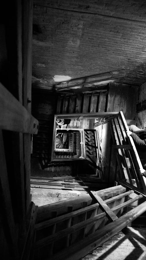 Old spiral stairs in wooden house