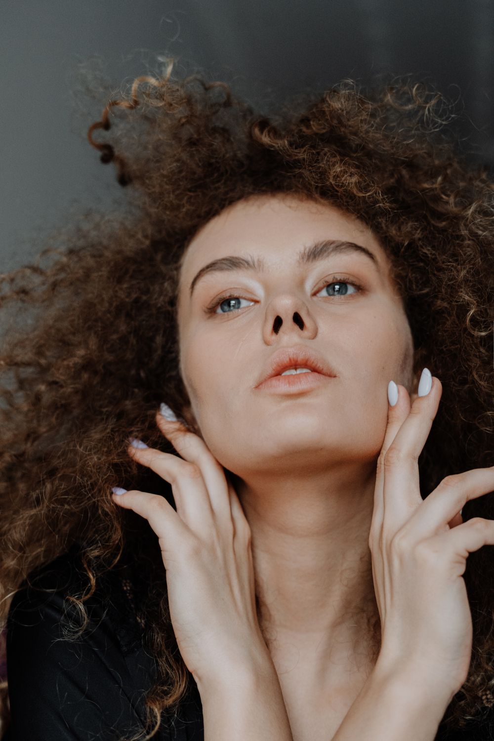 Woman With Brown Hair and Hand on Her Face · Free Stock Photo