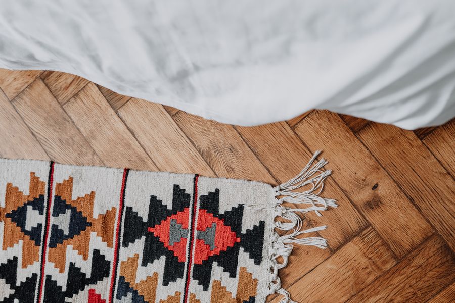 Cosy bedroom with fresh flooring and rug