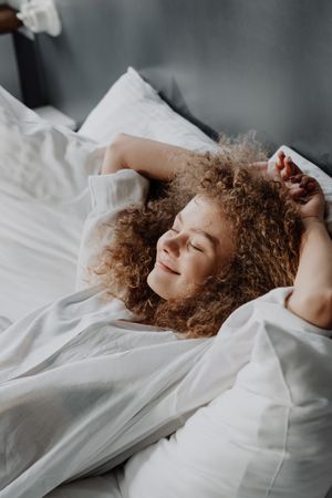 Person resting under white linen — cottonbro studio on Pexels