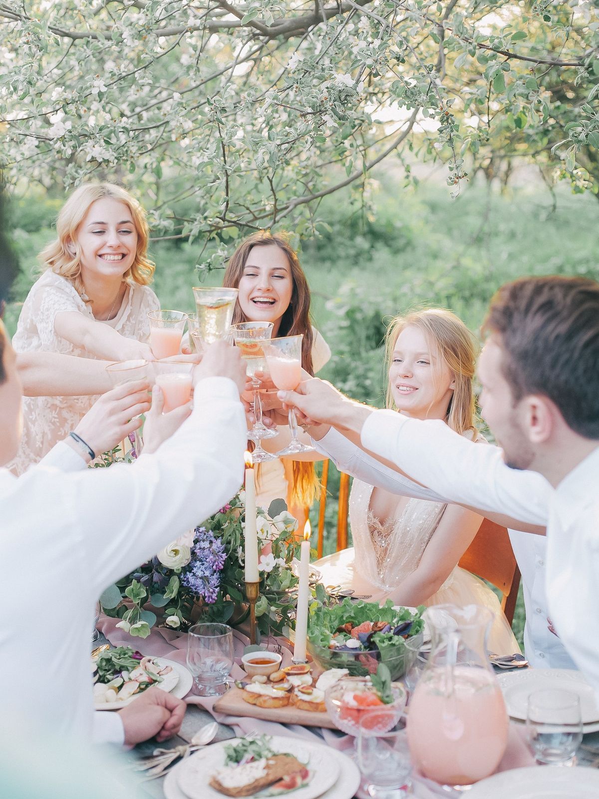 Guests toasting at an outdoor celebration