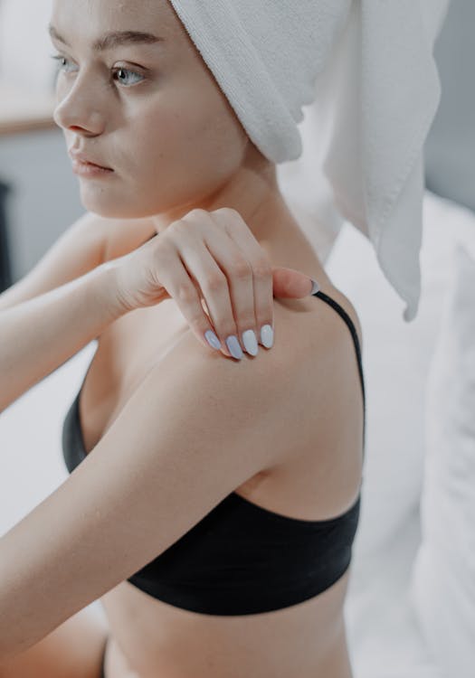 Free Woman in Black Tank Top With White Towel on Her Head Stock Photo