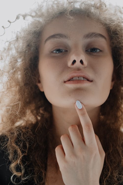 Girl With Brown Hair and White Manicure