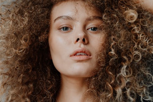 Beautiful curly-haired girl close-up