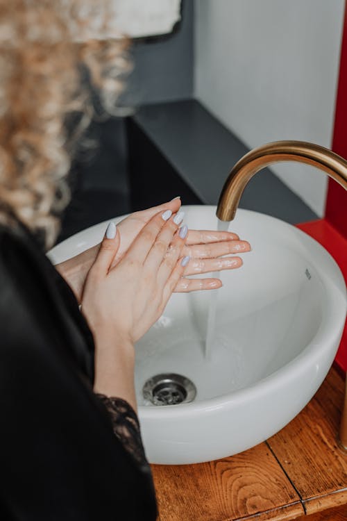Free Person Washing Hand on Sink Stock Photo