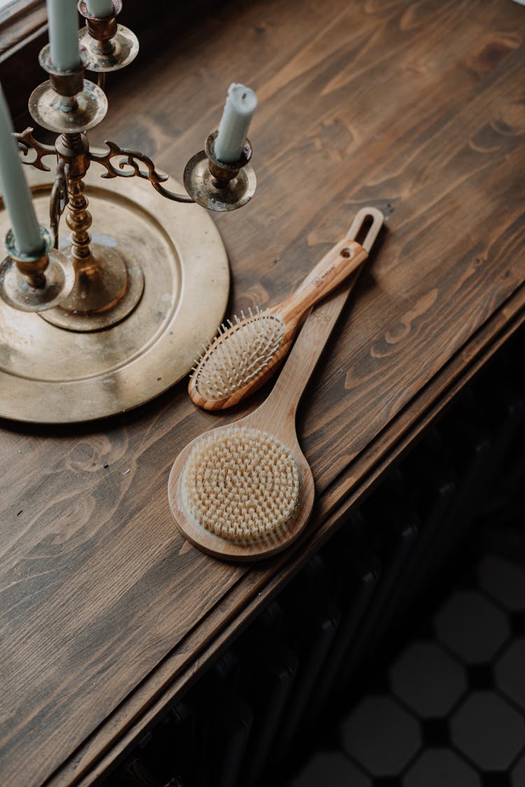 Brown Wooden Hair Brushes On Wooden Table