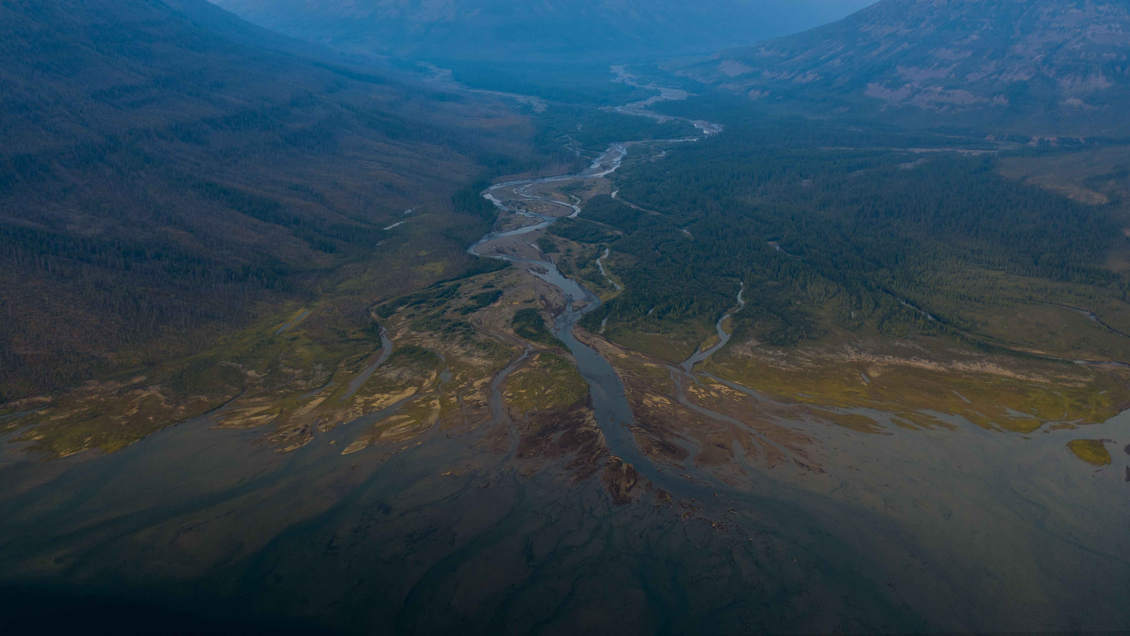 Aerial view of a winding river — photo by Ruslan Aizatulin on Pexels