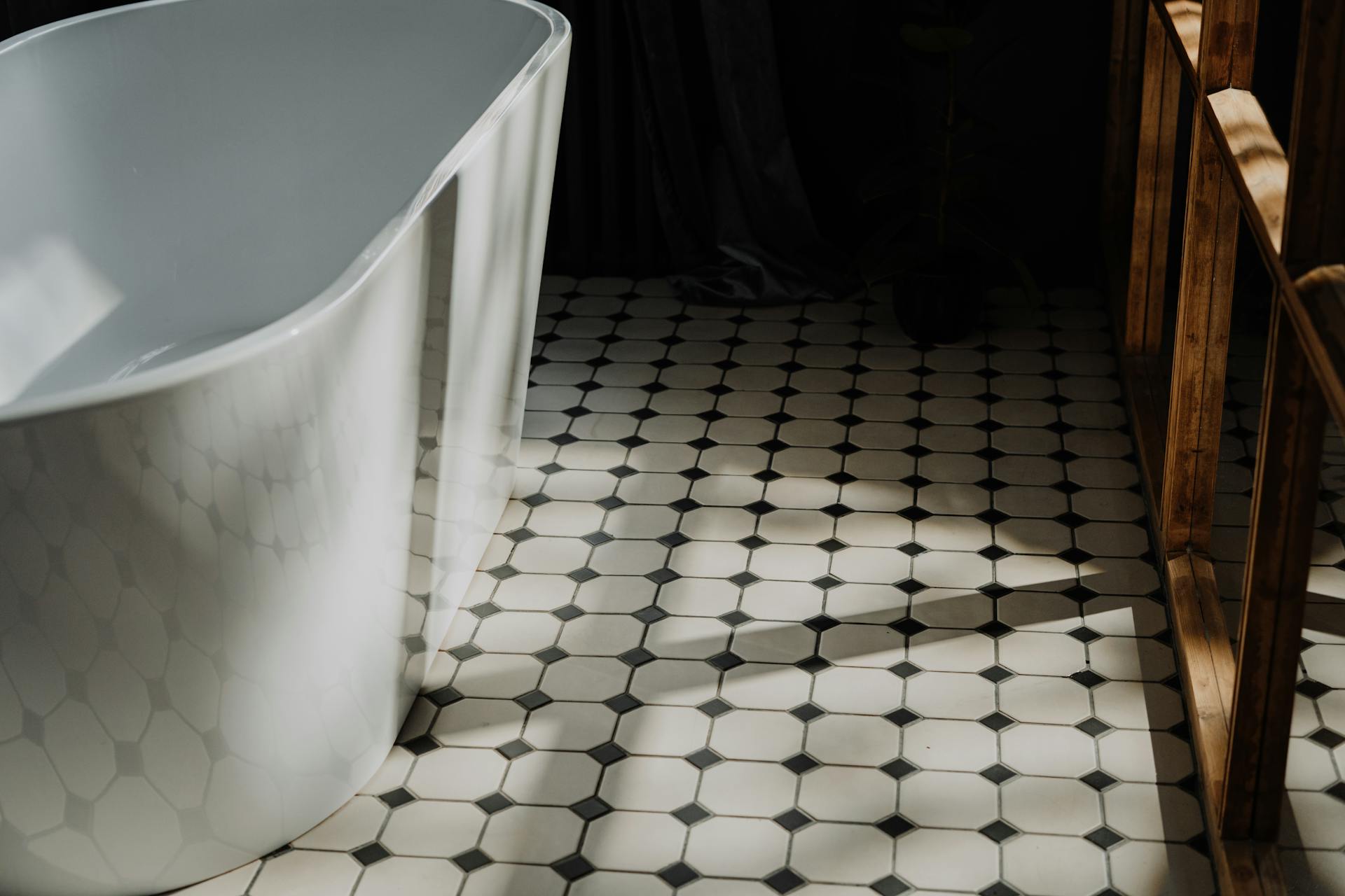 Clean Bathroom with White and Black Floor Tiles