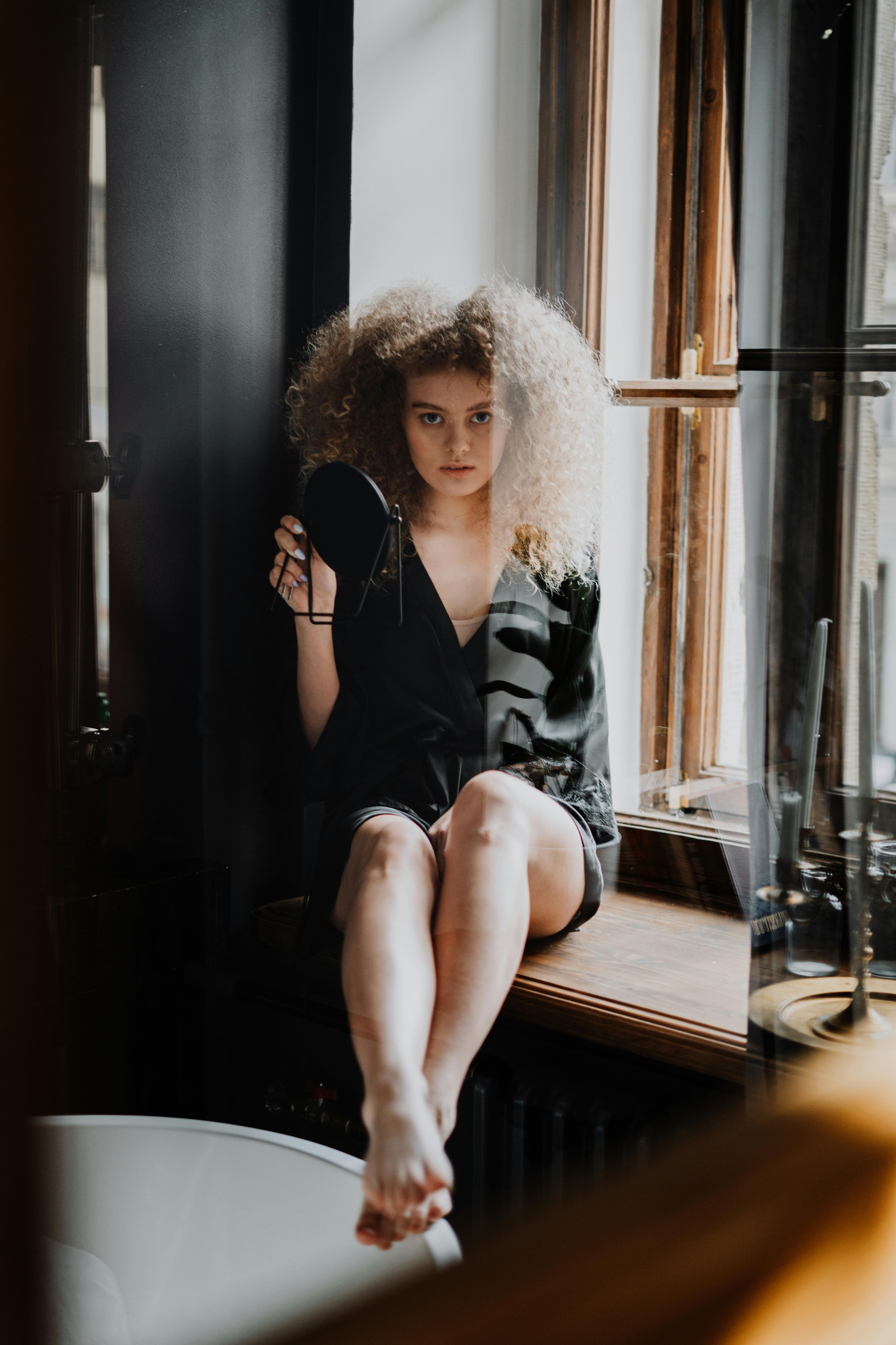 Woman in Black Skirt and White Shirt Kneeling on Floor · Free Stock Photo