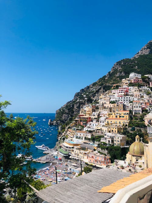 Beautiful Positano cliffside village on Amalfi Coast in southern Italy against cloudless blue sky on sunny day