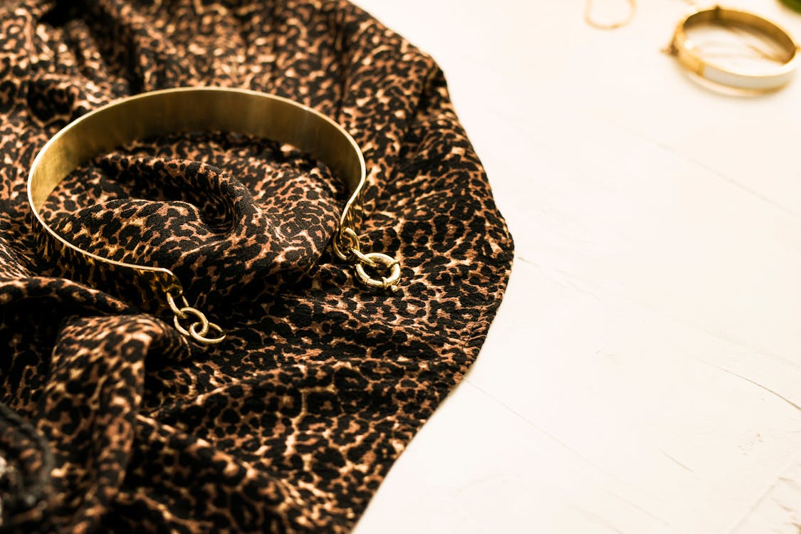 Free Gold Bangle on Leopard Cloth  Stock Photo