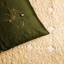 Gold Necklaces on Green Pillow 