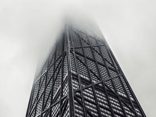 A High Rise Building on a Foggy Sky