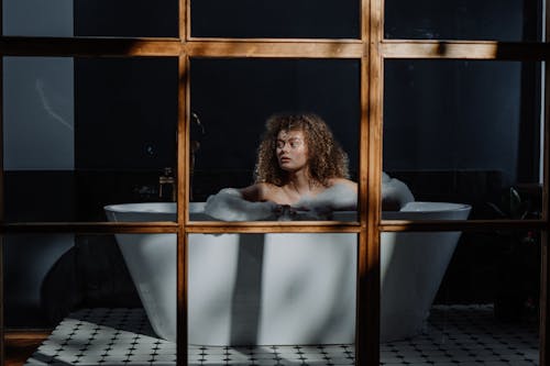 Woman in Bathtub With Water