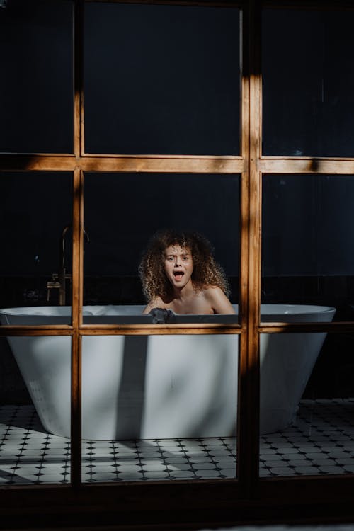 Woman in Bathtub With Water