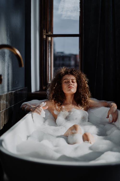 Free Woman in Bathtub With Water Stock Photo